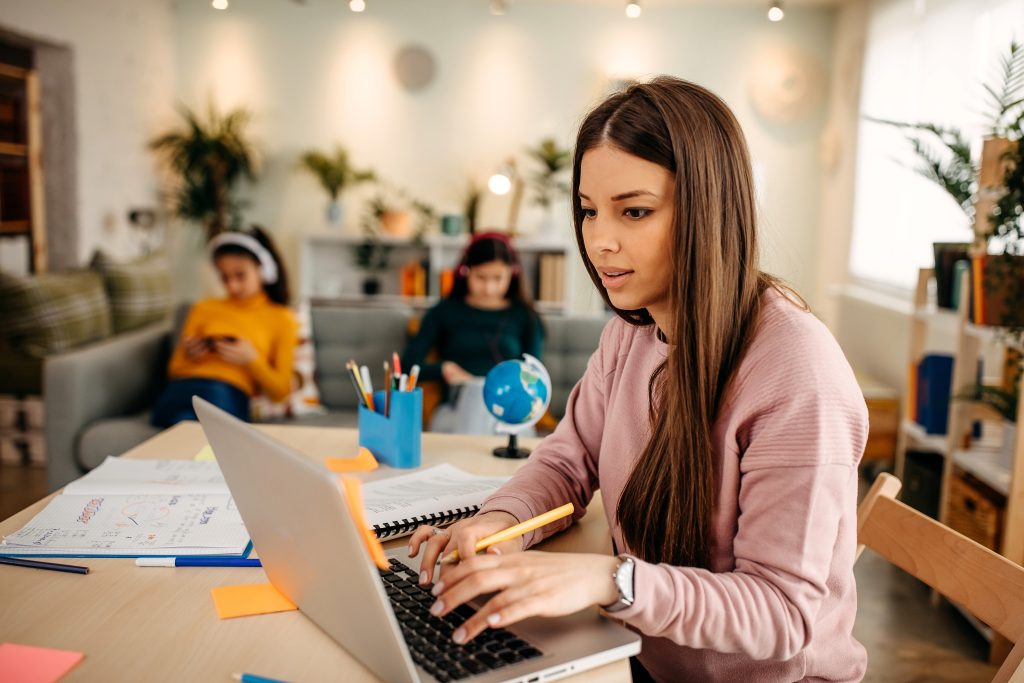 Mother is homeschooling her daughters.